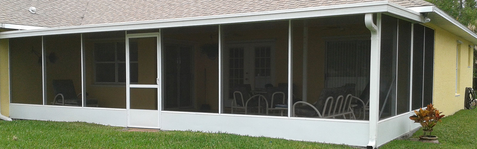 Large screened outdoor room attached to a Gulf Coast home