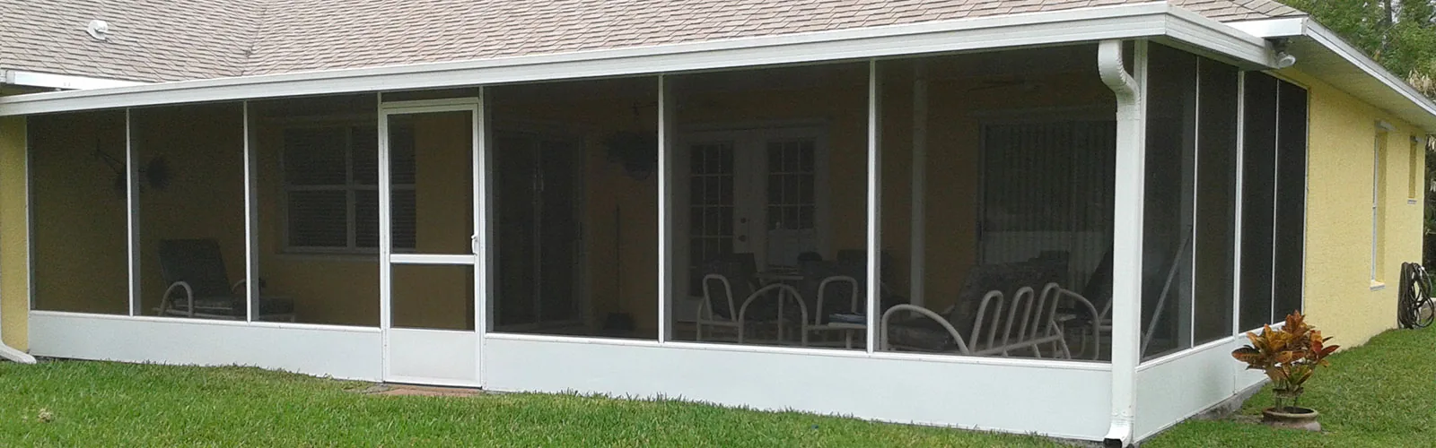 Large screened outdoor room attached to a Gulf Coast home